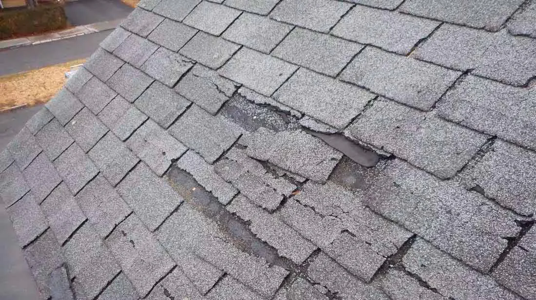 Roof with Damaged Shingles Needing Repair